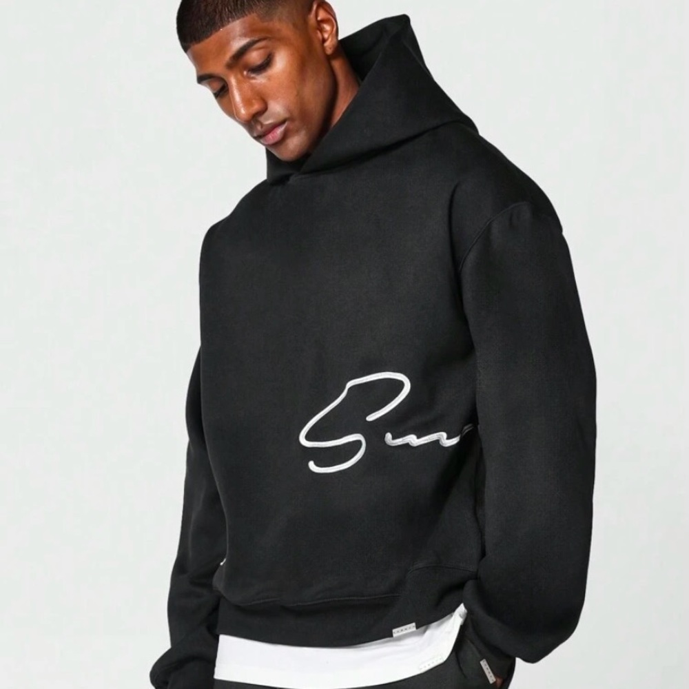 Black Pullover Hoodie with Relaxed Fit and Graphic Design